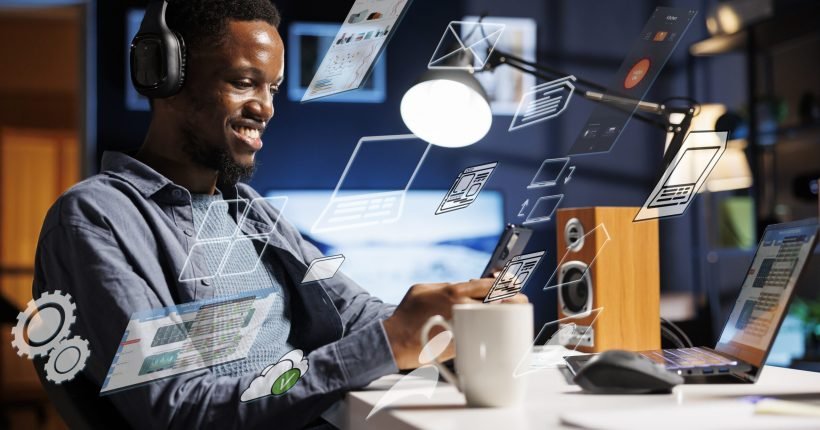 Business person using laptop multitasking to finish daily startup tasks, internet of things concept. Uses artificial intelligence optimization system for productivity, access pc smart things menu.